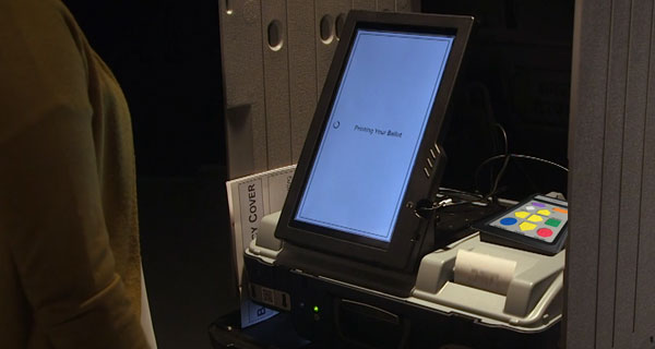 A message reading Printing Your Ballot on the Unisyn OpenElect ballot marking device.
